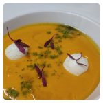Creamy, cold tomato and passion fruit soup with extra virgin olive oil ice-cream