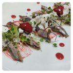 Salted anchovy and anchovy in vinegar with Cottage cheese and strawberries